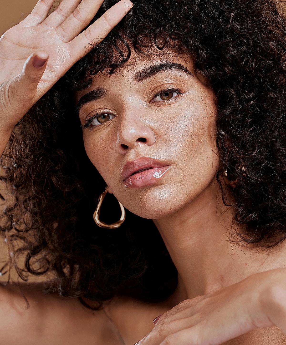 Woman with beautiful skin and red nail polish.