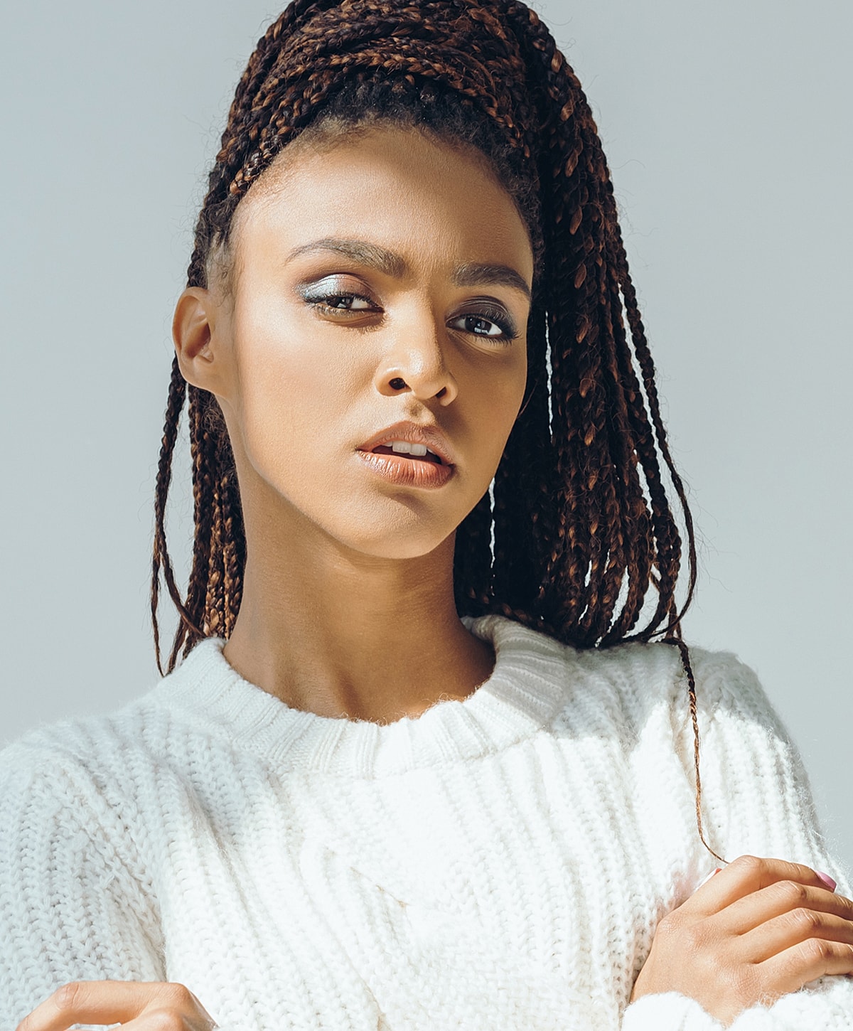 Woman with beautiful skin and red nail polish.