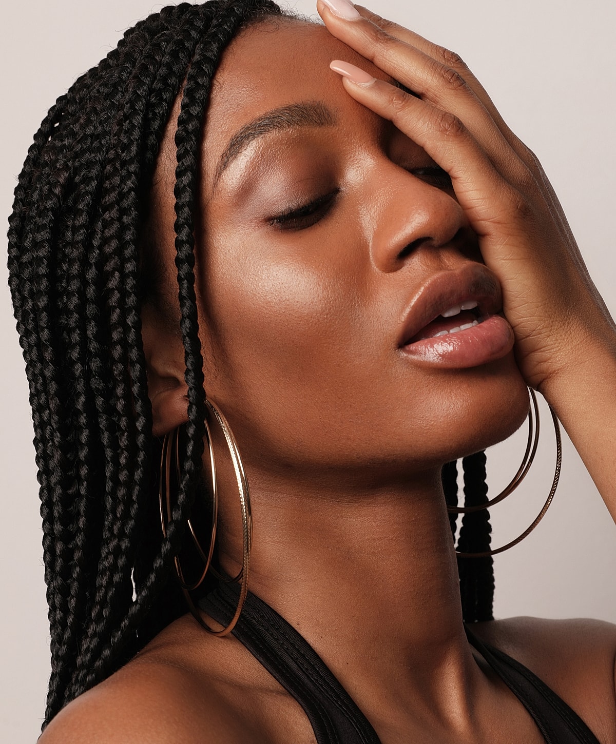 Woman with beautiful skin and red nail polish.