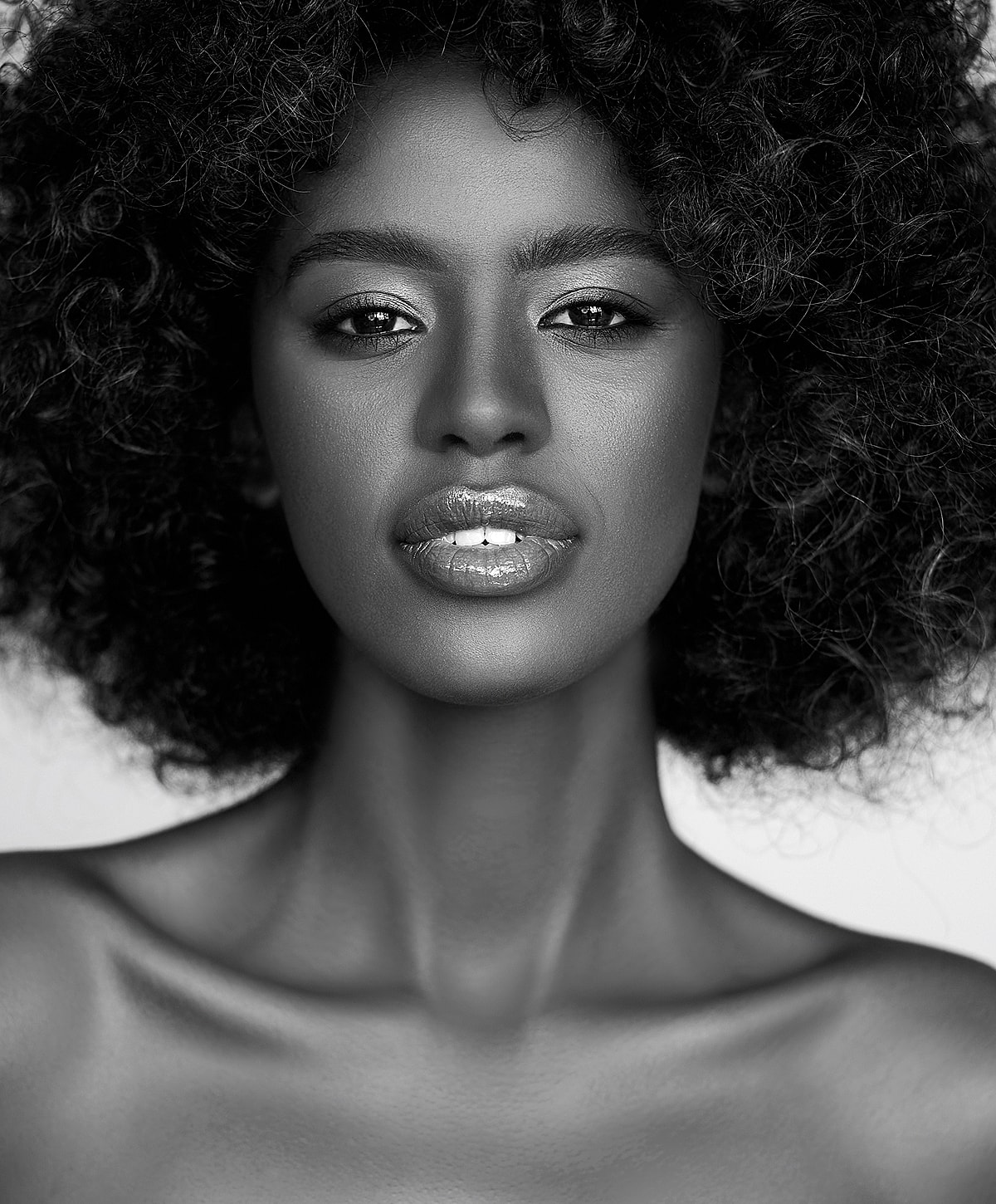 Woman with beautiful skin and red nail polish.
