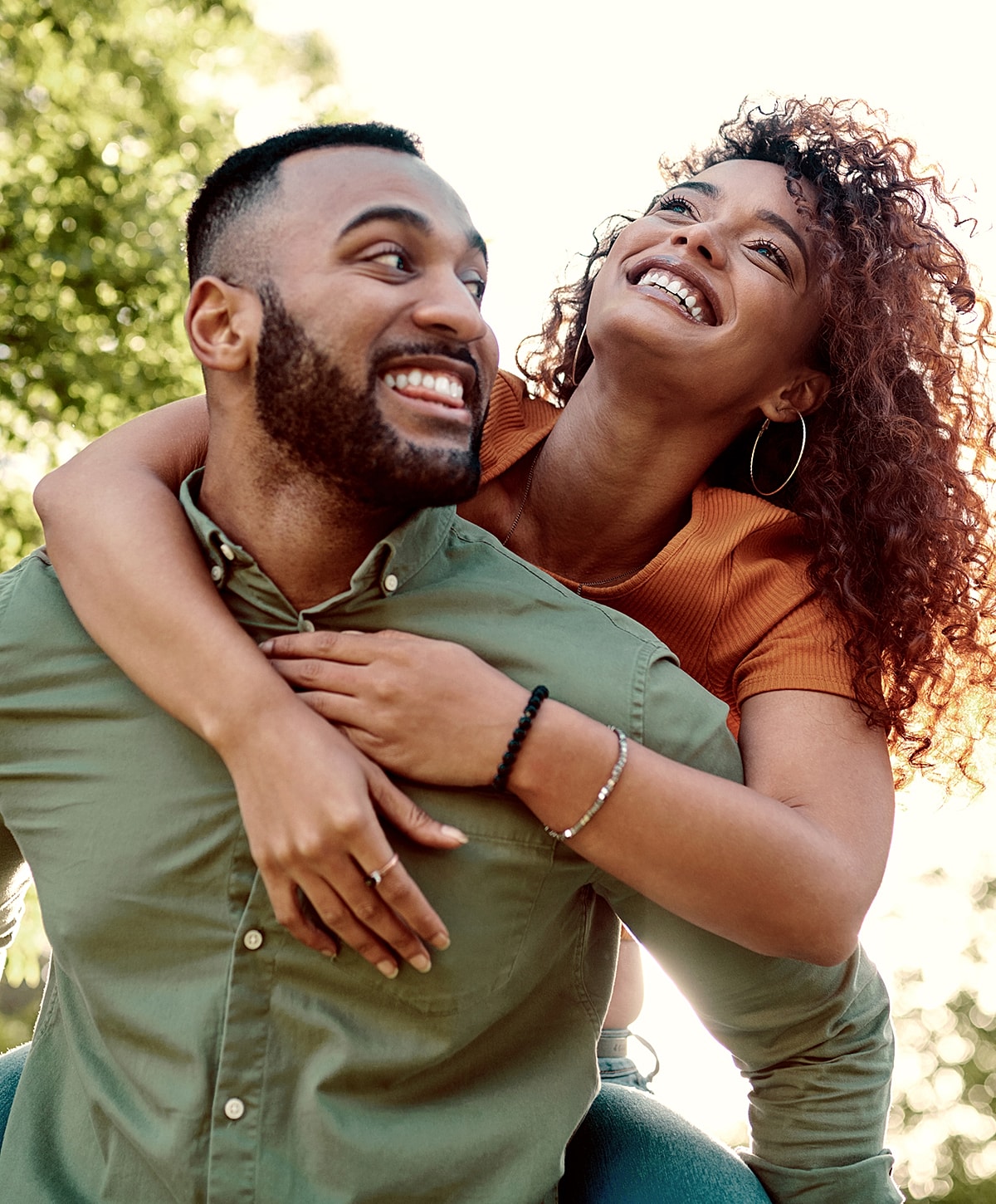 Happy couple enjoying each other's company outdoors.
