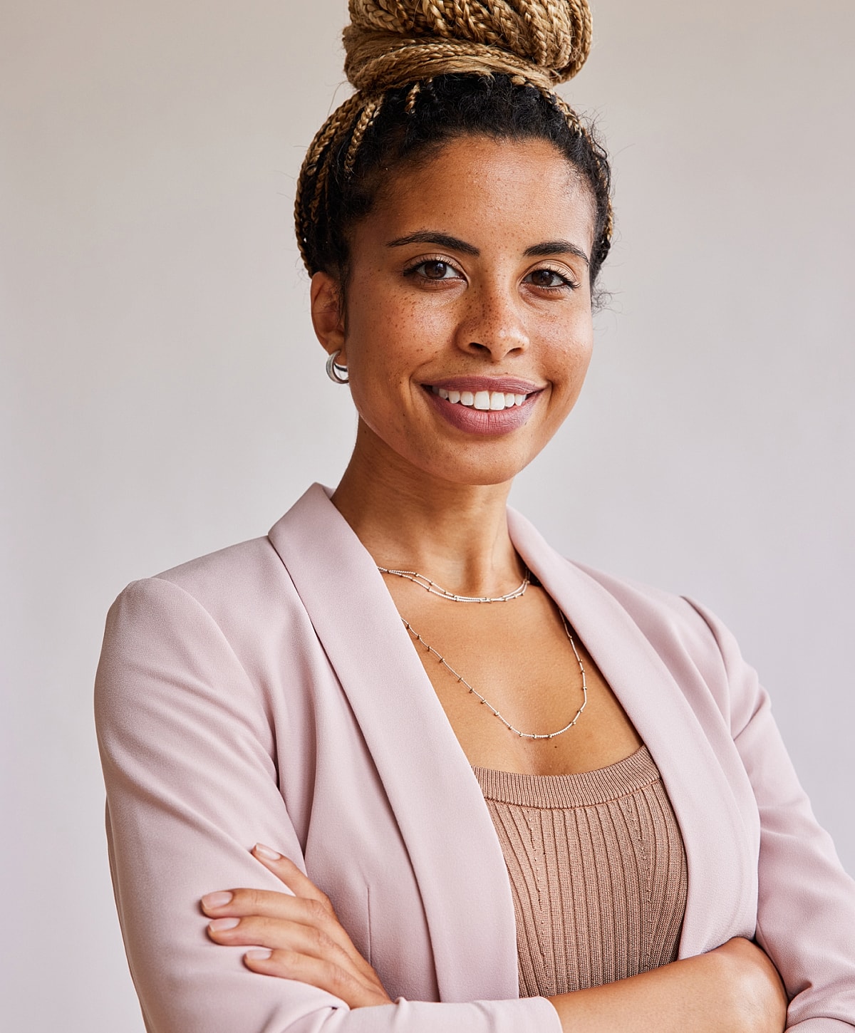 Smiling woman in a professional outfit, portrait.