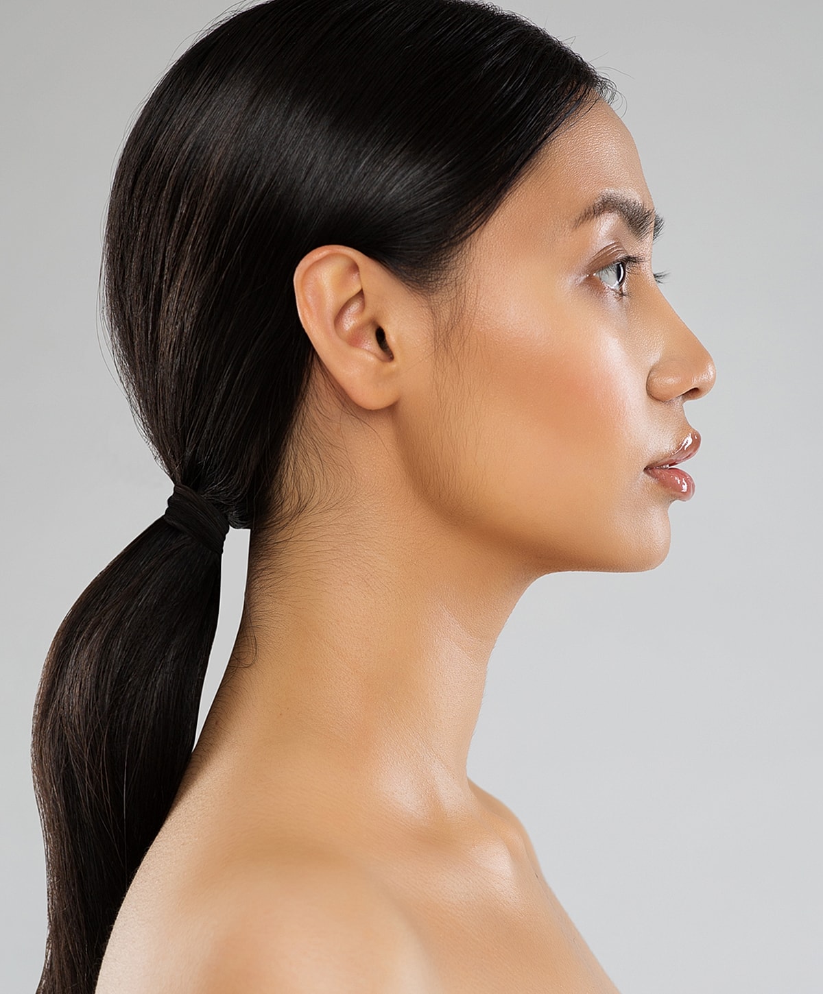 Profile view of a woman with long hair.