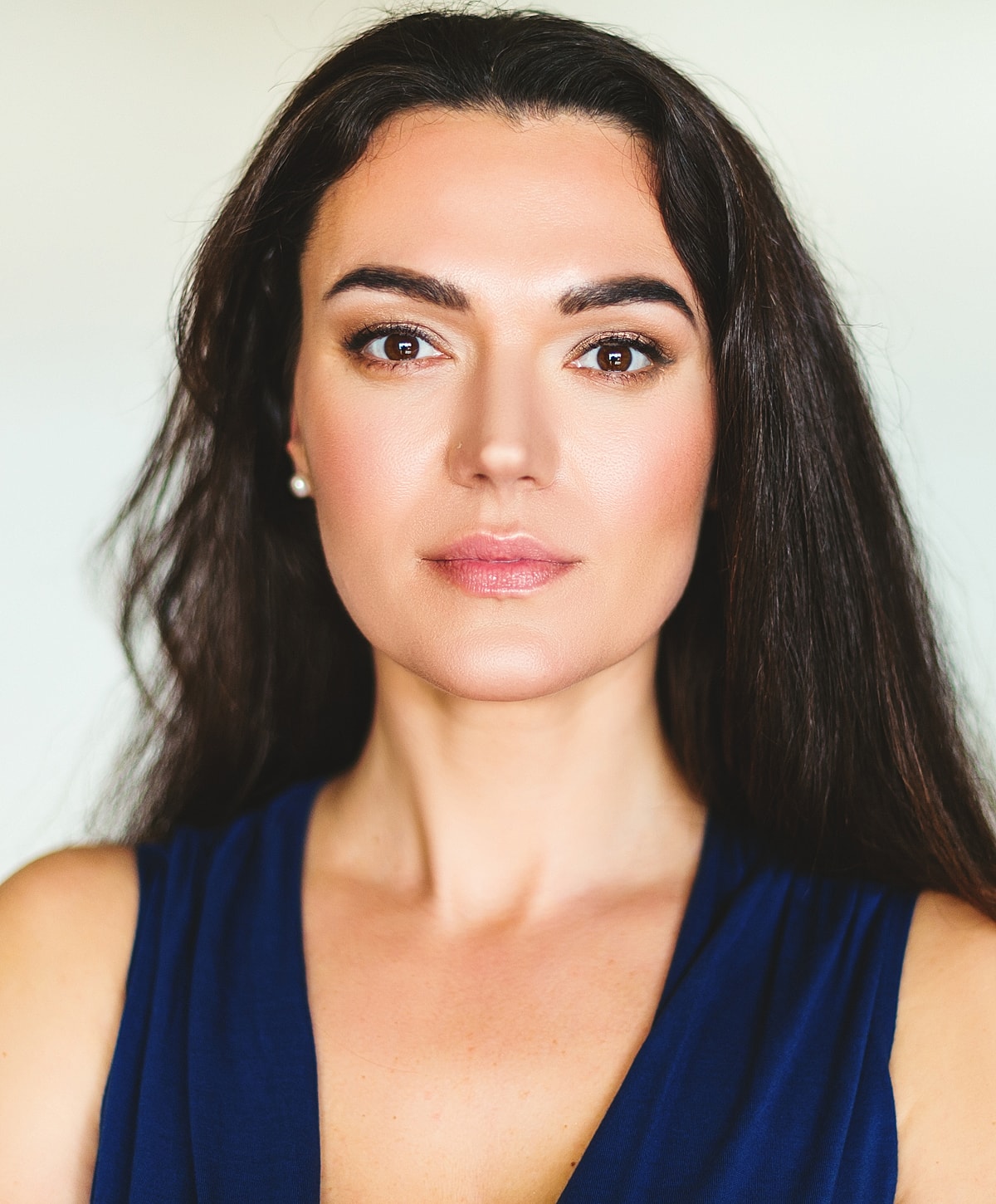 Portrait of a woman with long dark hair.