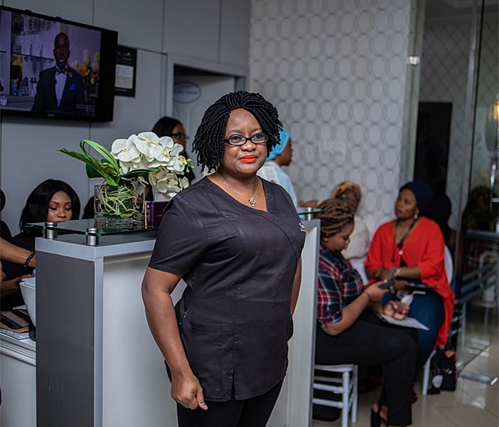 Woman in black top at a social event.
