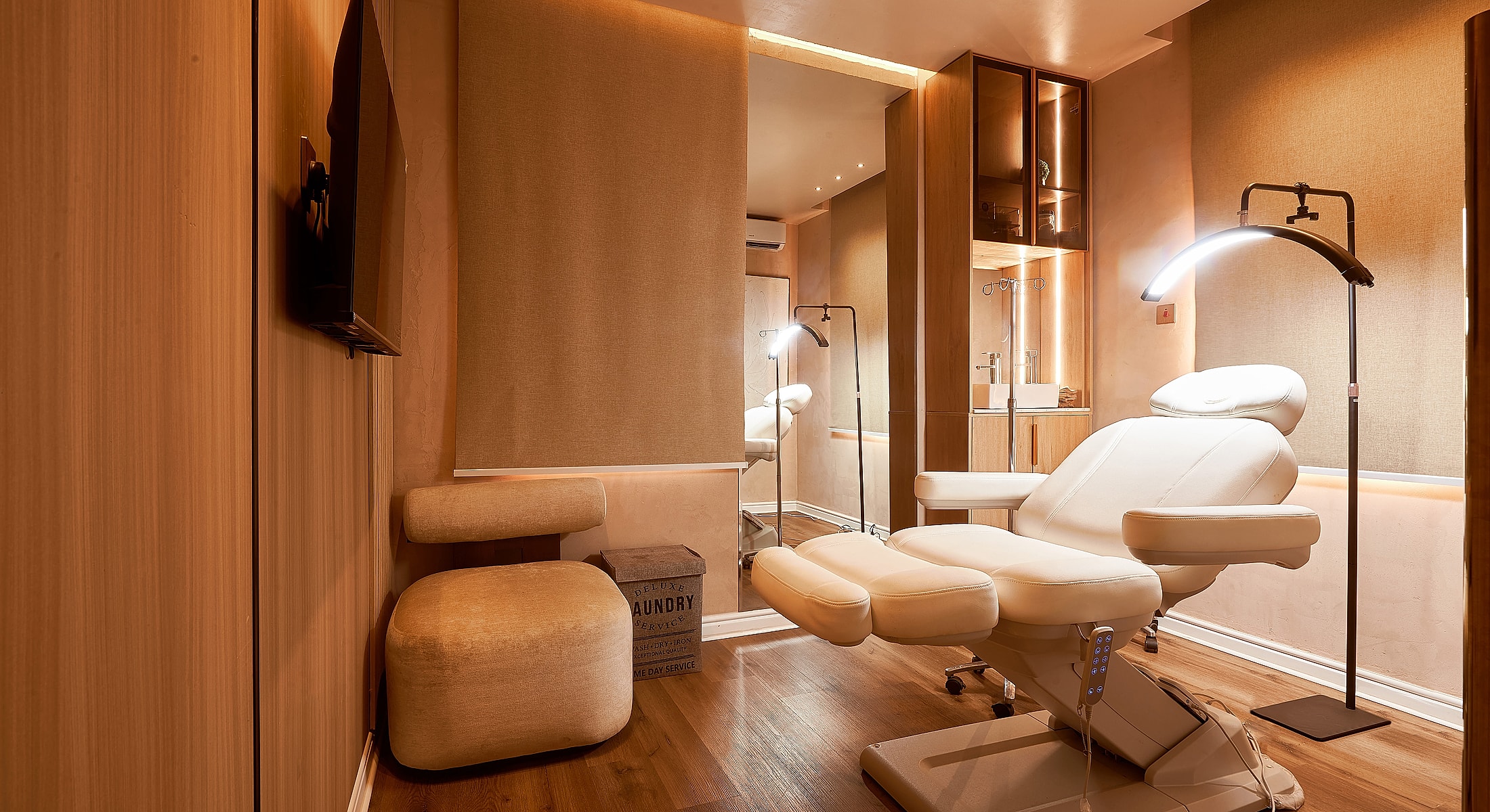 Modern, serene treatment room with adjustable chair.