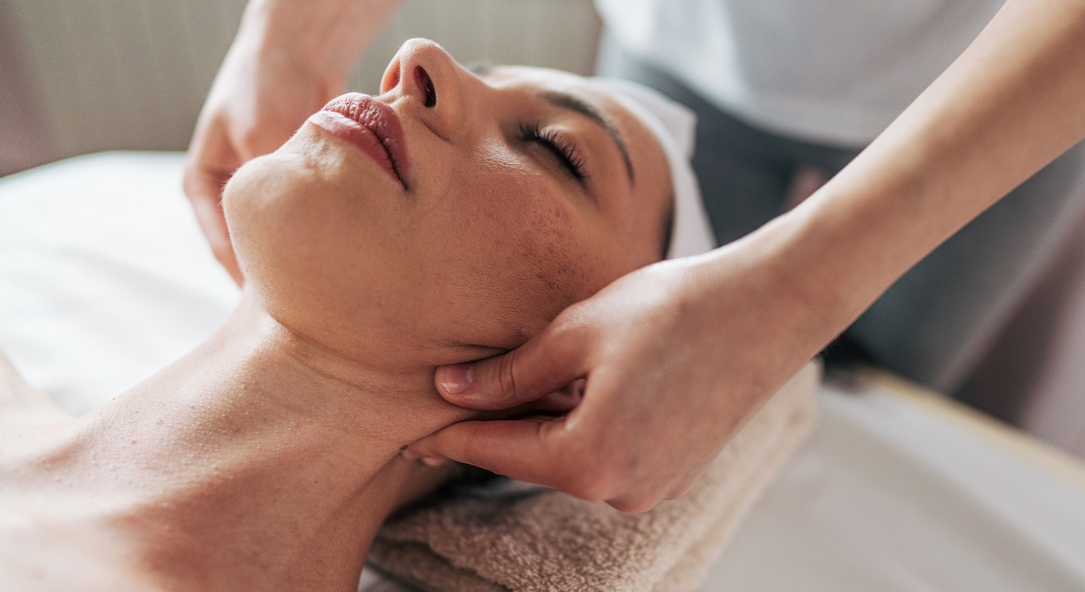 Facial massage treatment in a spa setting.