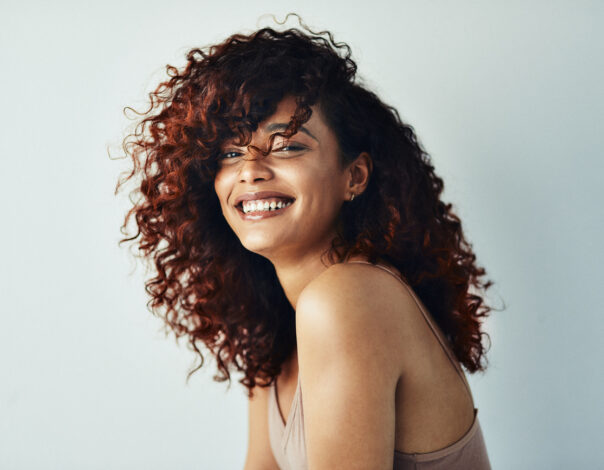Beautiful Women Smiling With Curly Hair
